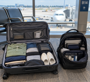 Carry-on suitcase and personal item bag packed for a flight